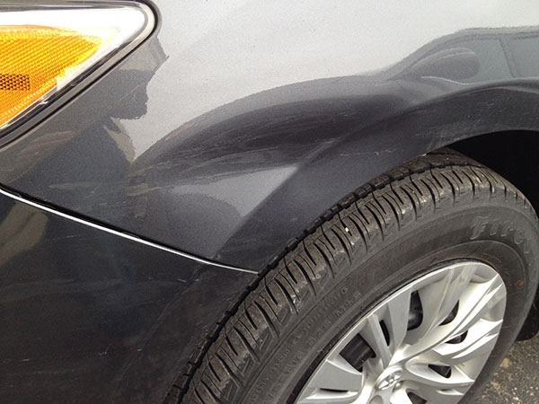 Toyota front fender after paintless dent repair with dent fully removed above the wheel in Fife Lake Michigan
