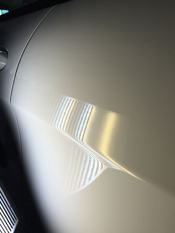 Smooth body panel on a Jeep after paintless dent repair completed in Fife Lake, Michigan