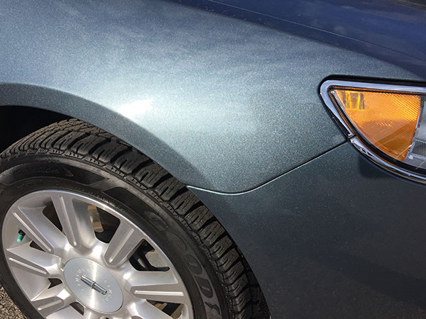 Lincoln MKZ front fender after paintless dent repair in Fife Lake, MI by Collins Dent Werks