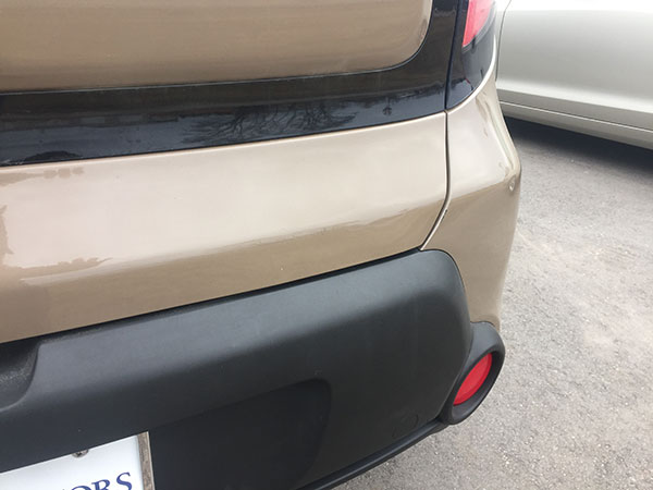 Kia rear panel after paintless dent repair completed by Collins Dent Werks in Fife Lake, Michigan