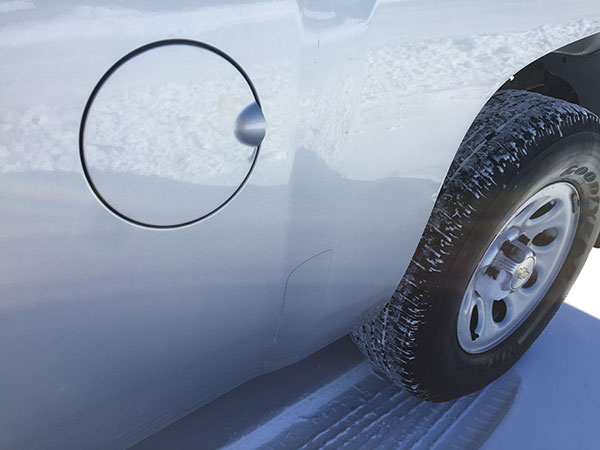 Chevrolet Silverado side panel after paintless dent repair by Collins Dent Werks in Fife Lake, Michigan