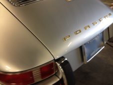 After paintless dent repair on a Porsche rear panel with dent fully removed in Fife Lake, Michigan