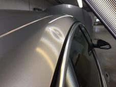 Vehicle roof showing hail dent damage before paintless dent repair at Collins Dent Werks in Fife Lake, Michigan
