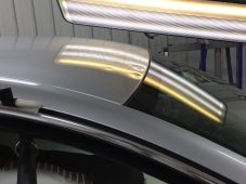 Vehicle roof showing hail dent damage before paintless dent repair at Collins Dent Werks in Fife Lake, Michigan