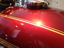 Harley-Davidson motorcycle fuel tank after paintless dent repair at Collins Dent Werks in Fife Lake, Michigan