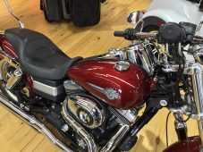 Finished paintless dent repair on a Harley-Davidson motorcycle fuel tank at Collins Dent Werks in Fife Lake, Michigan