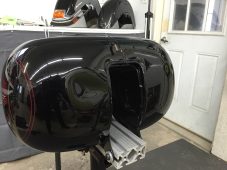 Completed paintless dent repair on a Harley-Davidson motorcycle fuel tank at Collins Dent Werks in Fife Lake, Michigan
