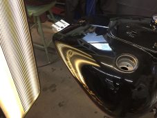 Harley-Davidson motorcycle fuel tank after paintless dent repair in Fife Lake, MI by Collins Dent Werks