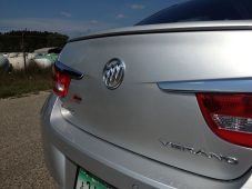 Rear view of a silver Buick Verano showing the trunk lid, Buick emblem, and rear taillights.
