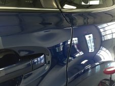 Subaru Outback door dent after paintless dent repair in Fife Lake, MI by Collins Dent Werks